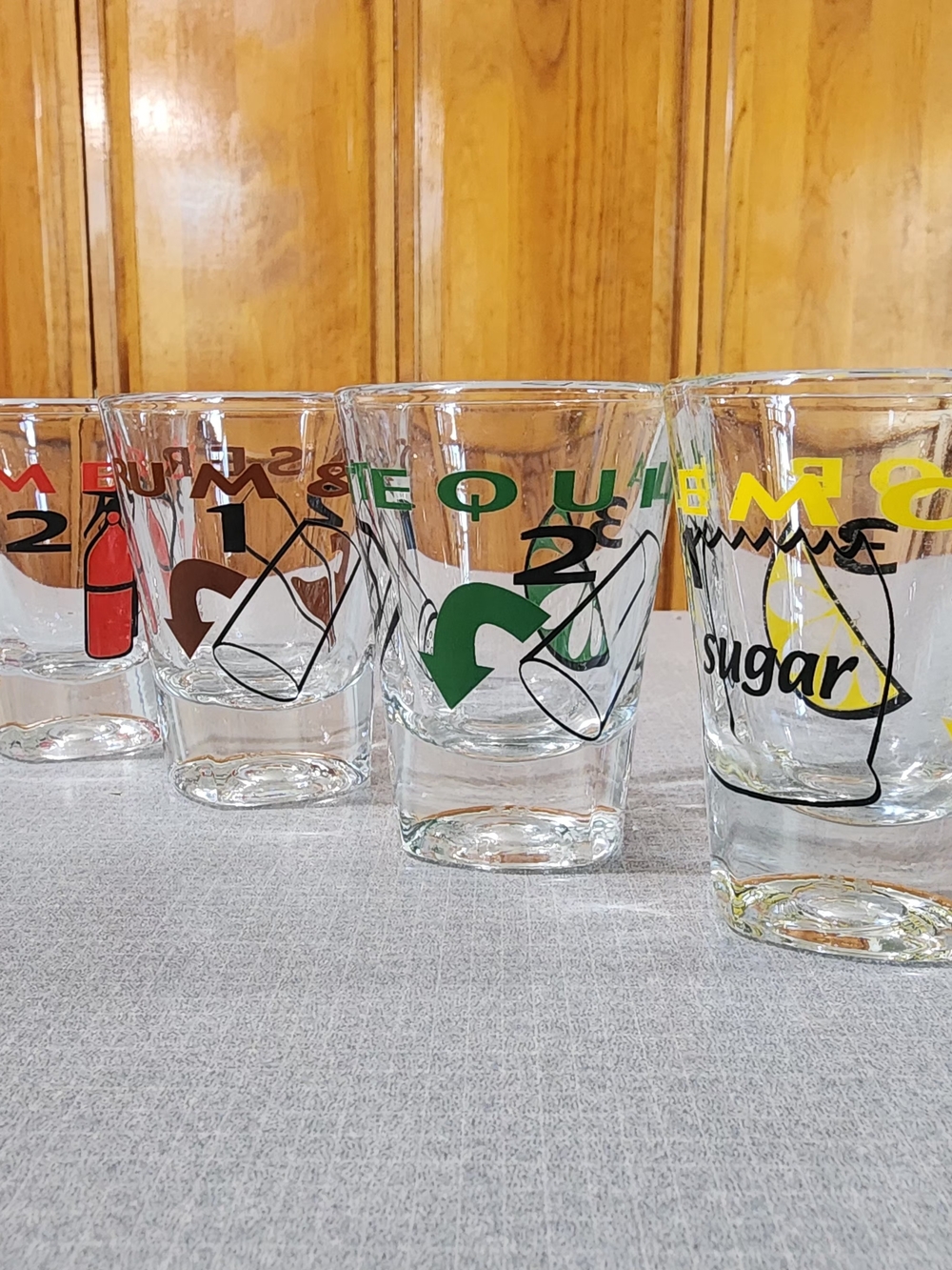 Clear Glass Shot Glasses with Multicolor Icons - Set of 4